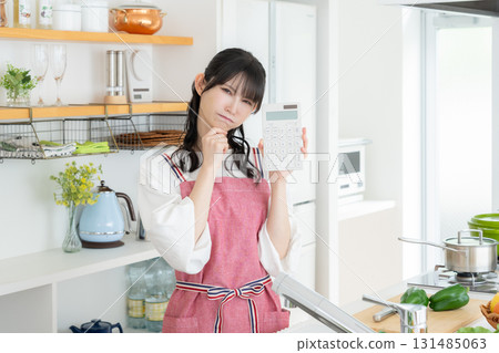 Middle-aged woman cooking in the kitchen Middle-aged woman cooking in the kitchen 131485063