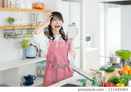 Middle-aged woman cooking in the kitchen Middle-aged woman cooking in the kitchen 131485064