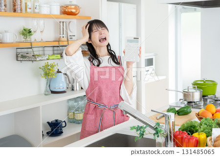 Middle-aged woman cooking in the kitchen Middle-aged woman cooking in the kitchen 131485065