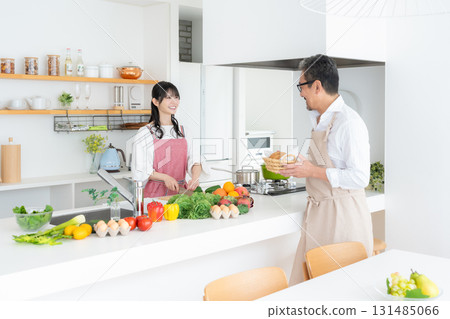 Middle-aged couple cooking in the kitchen Middle-aged couple cooking in the kitchen 131485066