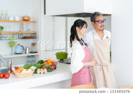 Middle-aged couple cooking in the kitchen Middle-aged couple cooking in the kitchen 131485076