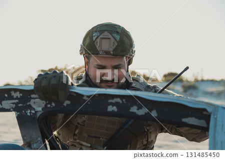 Soldier Tired And Sad Near A Car Wreck 131485450