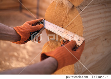 Construction of a house from rounded logs 131485526