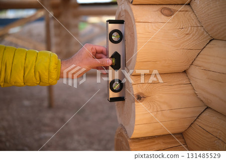 Construction of a house from rounded logs 131485529