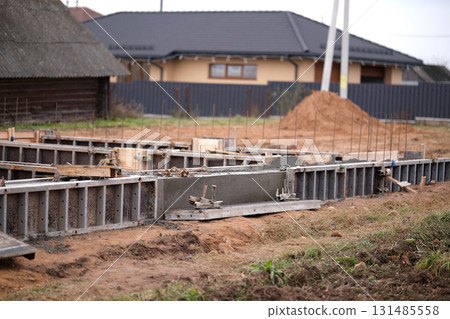 Construction of a concrete foundation for a house Construction of a concrete foundation for a house 131485558