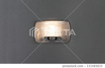 Close-up of the interior lamp above the driver's seat of a car 131485633
