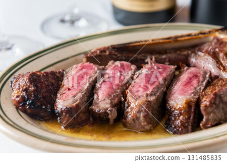 A cross section of a juicy T-bone steak A cross section of a juicy T-bone steak 131485835