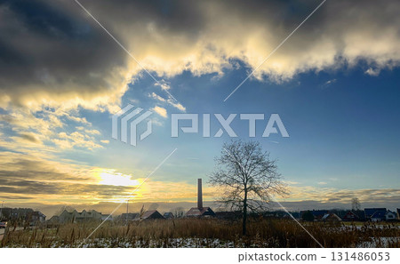 Witness the stunning beauty of a mesmerizing Winter Sunset Over a perfectly serene landscape Witness the stunning beauty of a mesmerizing Winter Sunset Over a perfectly serene landscape 131486053