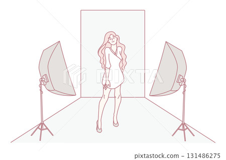 Woman model posing in dress in studio 131486275