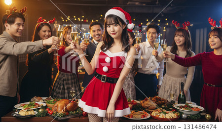 Woman dressed as Santa at Christmas party 131486474