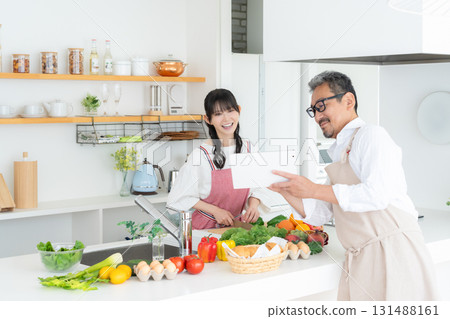 Middle-aged couple cooking in the kitchen 131488161