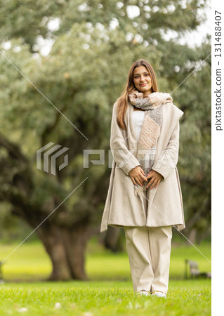 Young woman enjoying autumn day in park 131488407