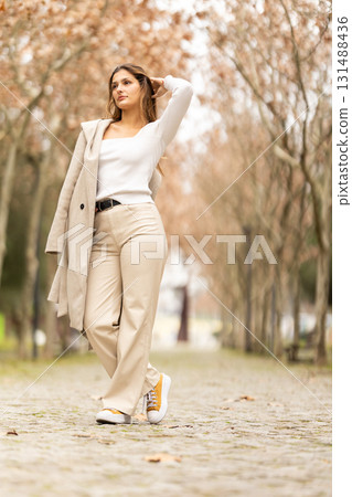 Young woman posing in stylish autumn fashion Young woman posing in stylish autumn fashion 131488436