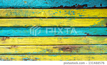 Texture of vintage wood boards with cracked paint of yellow, blue and green color. Horizonta 131488576