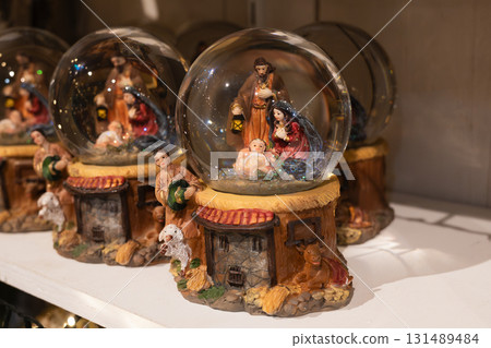 A glass balls with the Scene of the birth of Jesus Christ with Mary and Joseph 131489484