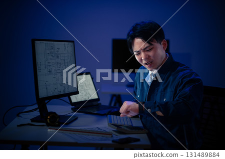 Young people working overtime Young people working overtime 131489884