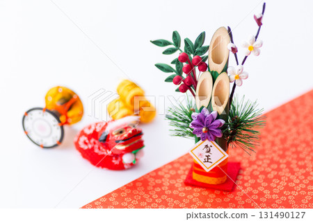 New Year's pine decoration on a red and white background New Year's pine decoration on a red and white background 131490127