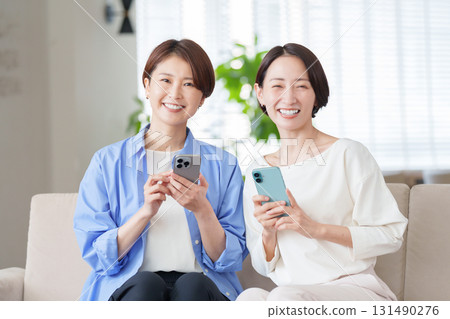 Women using smartphones 131490276