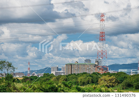 Power line tower standing on the banks of the Yodo River, Takatsuki City, Osaka Prefecture Power line tower standing on the banks of the Yodo River, Takatsuki City, Osaka Prefecture 131490376