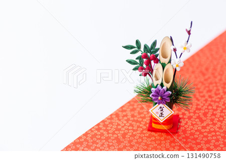 New Year's pine decoration on a red and white background 131490758
