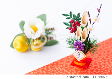 New Year's pine decoration on a red and white background New Year's pine decoration on a red and white background 131490760