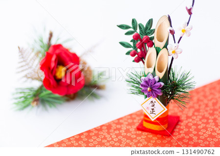New Year's pine decoration on a red and white background New Year's pine decoration on a red and white background 131490762
