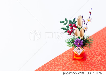 New Year's pine decoration on a red and white background 131490763