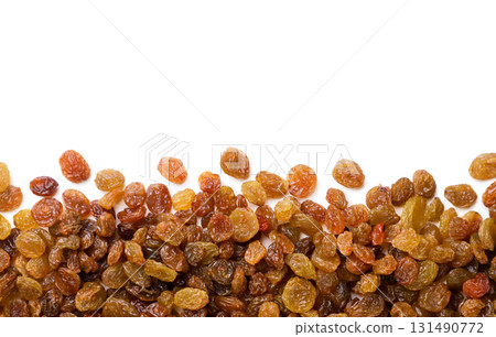 Raisins scattered on a white background. Top view Raisins scattered on a white background. Top view 131490772