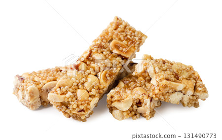 Granola bars and halves close-up on a white. Isolated Granola bars and halves close-up on a white. Isolated 131490773