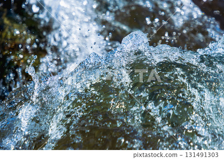 Early summer waterside: Close-up of a clear stream bubbling with water flow 116 131491303