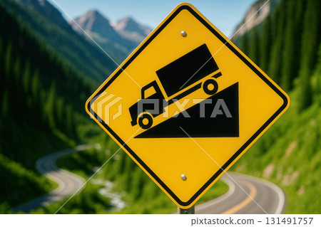 Steep Grade Truck Warning Sign on Mountain Switchback Road 131491757