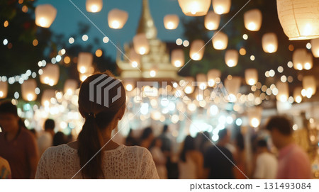 Lantern festival Yi Peng  with blurred temple and crowd at twilight, background 131493084