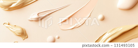 Fluid cosmetics textures featuring spread highlighter and foundation cream 131493105