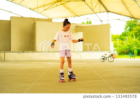 Asian teen girl roller skating. Roller-skating. Korea Asian teen girl roller skating. Roller-skating. Korea 131493578