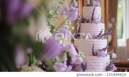 Wedding cake with lavender flowers. Holiday table decoration 131494914