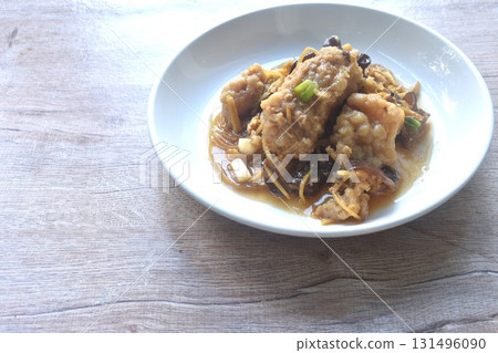 spicy deep fried chop Nile Tilapia or mango fish slice ginger and ear mushroom couple celery dressing soy sauce on plate spicy deep fried chop Nile Tilapia or mango fish slice ginger and ear mushroom couple celery dressing soy sauce on plate 131496090
