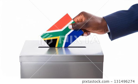 Hand voting ballot paper and ballot box on South African flag. Election. 131496274