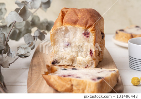 Dining table with dried fruits and bread 131496448