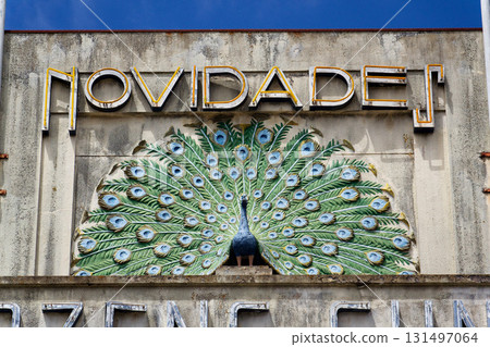 Peacock on facade of art deco building Armazens Cunhas shop designed by architects Manuel Marques, Amoroso Lopes and Coelho Freitas 131497064