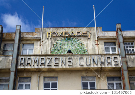 Peacock on facade of art deco building Armazens Cunhas shop designed by architects Manuel Marques, Amoroso Lopes and Coelho Freitas Peacock on facade of art deco building Armazens Cunhas shop designed by architects Manuel Marques, Amoroso Lopes and Coelho Freitas 131497065