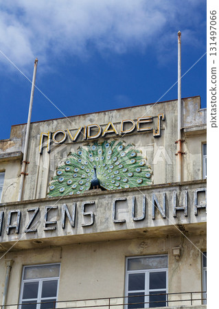 Peacock on facade of art deco building Armazens Cunhas shop designed by architects Manuel Marques, Amoroso Lopes and Coelho Freitas 131497066