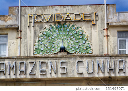 Peacock on facade of art deco building Armazens Cunhas shop designed by architects Manuel Marques, Amoroso Lopes and Coelho Freitas Peacock on facade of art deco building Armazens Cunhas shop designed by architects Manuel Marques, Amoroso Lopes and Coelho Freitas 131497071
