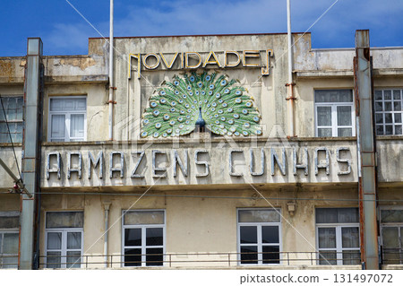 Peacock on facade of art deco building Armazens Cunhas shop designed by architects Manuel Marques, Amoroso Lopes and Coelho Freitas 131497072