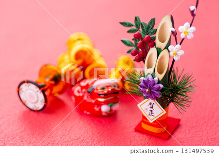 Golden background with Kadomatsu and New Year's decorations Golden background with Kadomatsu and New Year's decorations 131497539