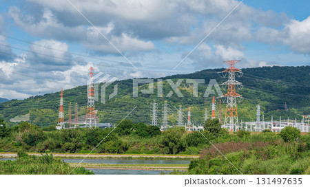 Power line tower standing on the banks of the Yodo River, Takatsuki City, Osaka Prefecture 131497635