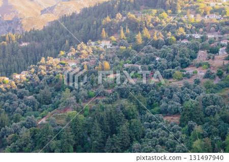 Mountain village Lakkoi in western Crete surrounded by pine forest on sunny day. Mountain village Lakkoi in western Crete surrounded by pine forest on sunny day. 131497940