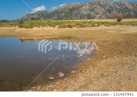 Climate change issue, lake drying in Omalos village in Crete White mountains. Climate change issue, lake drying in Omalos village in Crete White mountains. 131497941