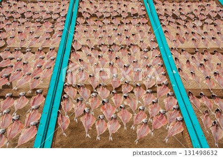 Dried fish outdoors, a tradition on Nazare beach, in Portugal Dried fish outdoors, a tradition on Nazare beach, in Portugal 131498632