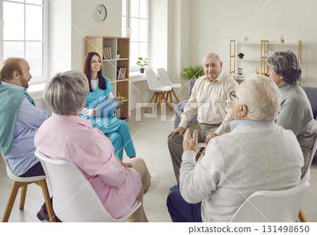Young nurse, caregiver or psychologist woman having conversation with senior people. Young nurse, caregiver or psychologist woman having conversation with senior people. 131498650