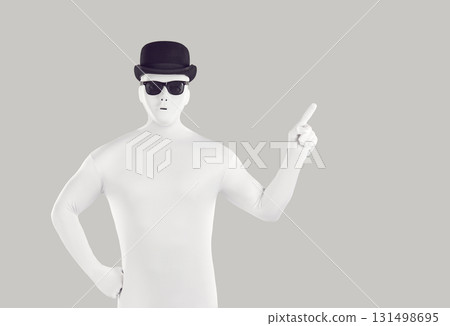 Portrait of faceless unrecognizable person wearing black hat and glasses in white spandex costume 131498695